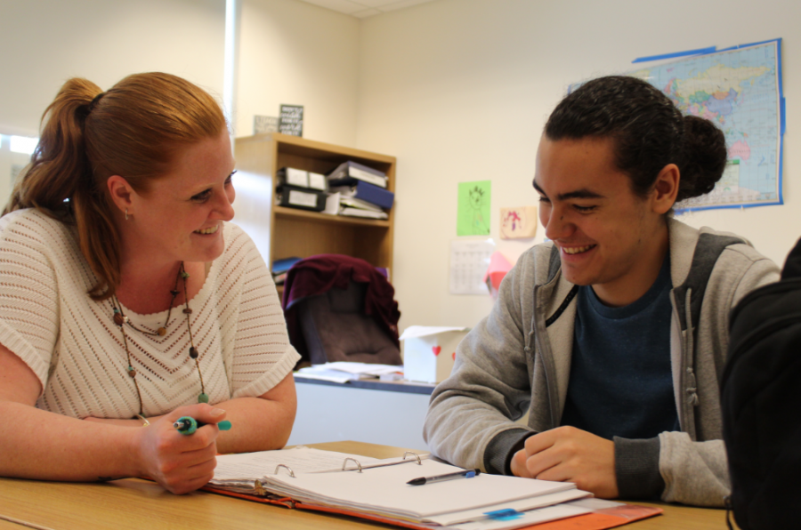 Alissa Luippold happily works with sophomore Michael McWilliams.