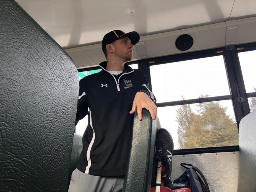 Physical education teacher Andrew Kinney scans the bus to make sure everyone is onboard to head home after a tough game.