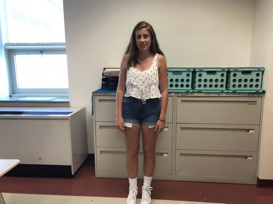 Junior Sara Prendergast is wearing a tank top and shorts she cut herself.