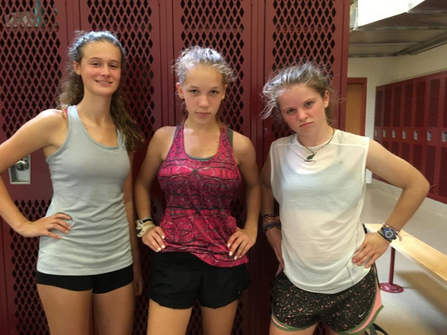 Juniors Julia Kardos and Karmyn Shreeve and sophomore Kaitlyn Desio [From left to right] flaunt an athletic look for the first day. “It’s good to wear a tank top and shorts on hot days or else you’ll die,” Shreeve said. 