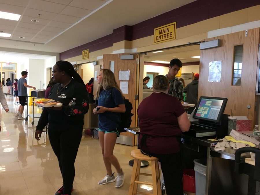 Juniors Nardly Pierre-Jerome and Hailey Thompson exit the lunch line.