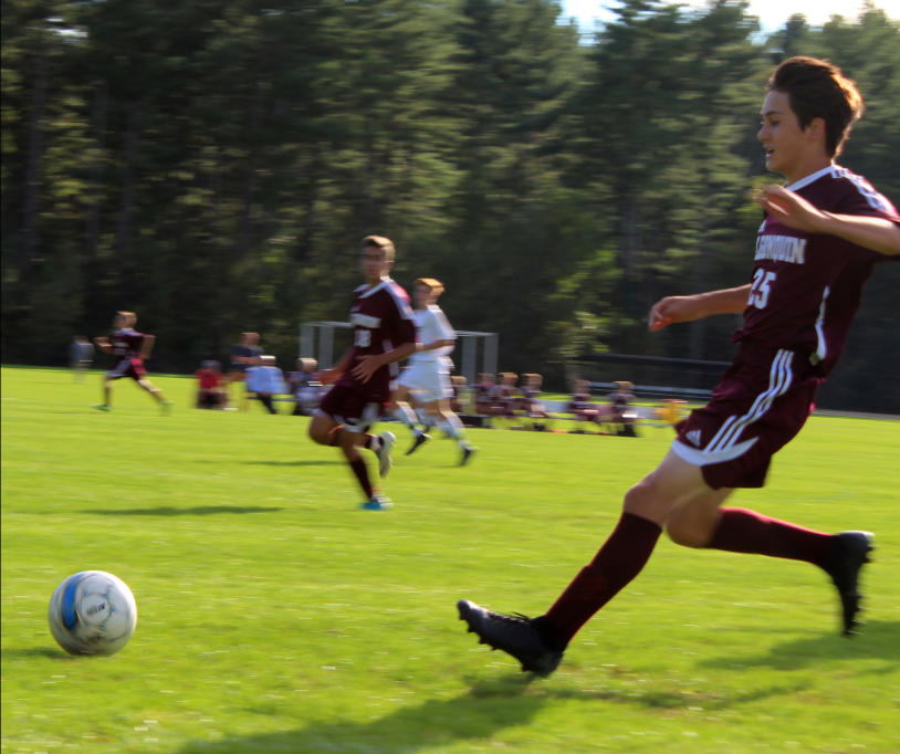 Donning+his+maroon+soccer+jersey%2C+sophomore+Nick+Haugen+sprints+down+the+field+at+a+home+game+against+Wachusett+on+September+27.