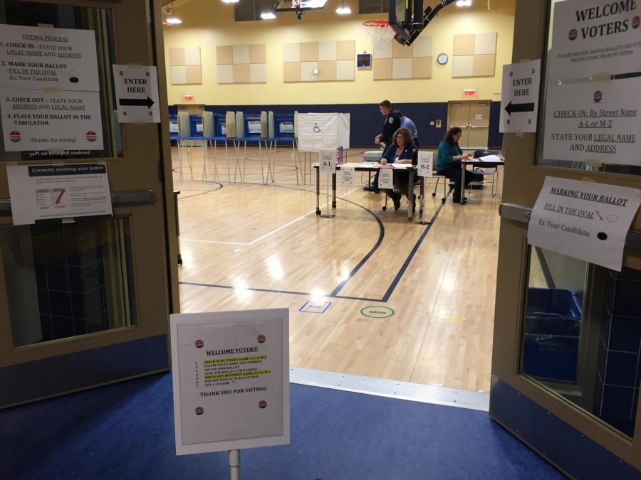 After 13 hours of hard work, election workers finish up paperwork to conclude voting in Northboroughs 2nd precinct. 