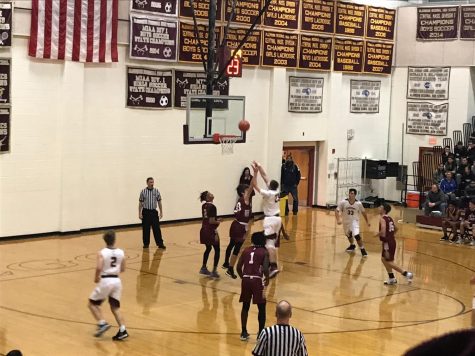 Senior captain Nick Redden shoots in the paint to help the boys' basketball team beat Doherty 66-60 on December 7.  Redden finished with 17 points. 
