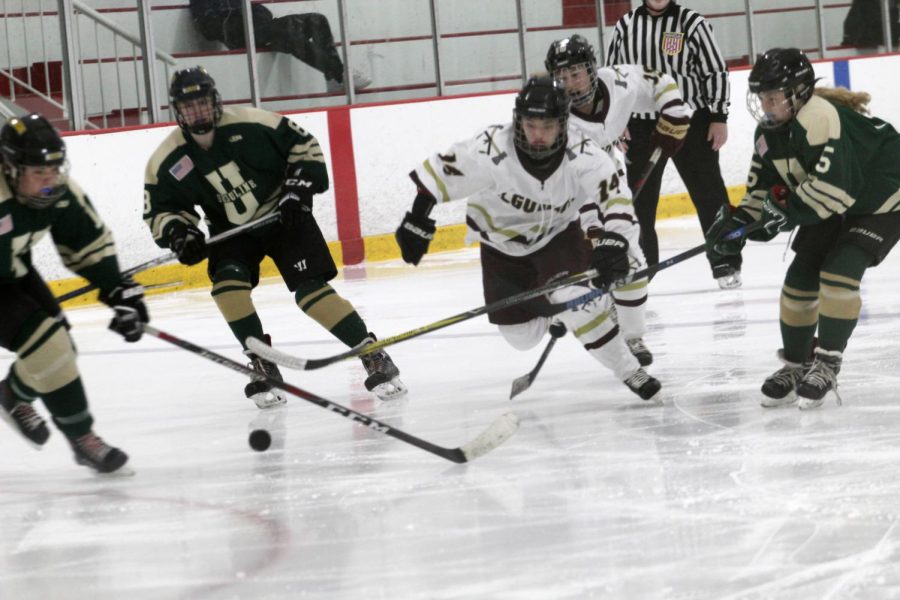 Algonquin sophomroe forward Averi Curran races after the puck to attempt a shot on Ursulines goal. In her first year on the team Curran made a large impact.