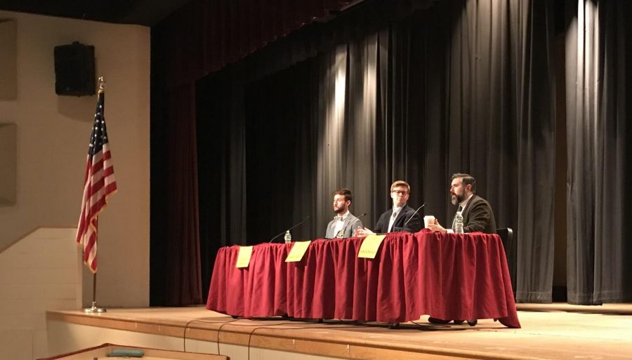 Assistant Dean of Admissions at Framingham State University John Chenier [right] responds to a student’s question during a college panel for the junior class on January 31.