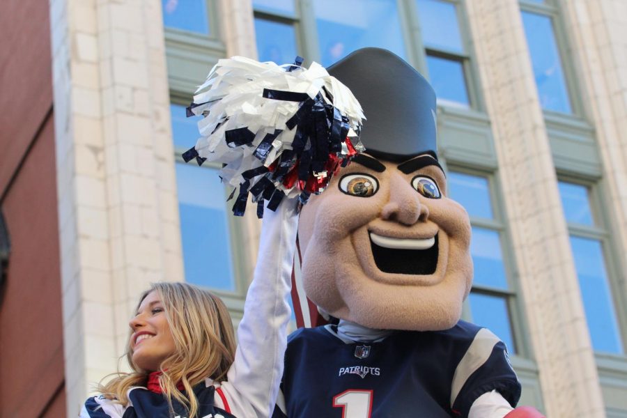 Pat Patriot greeted fans on a float with the cheerleaders.