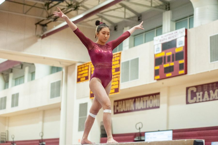 Junior Sequoia Truong performs her routine on the beam at States on March 2.