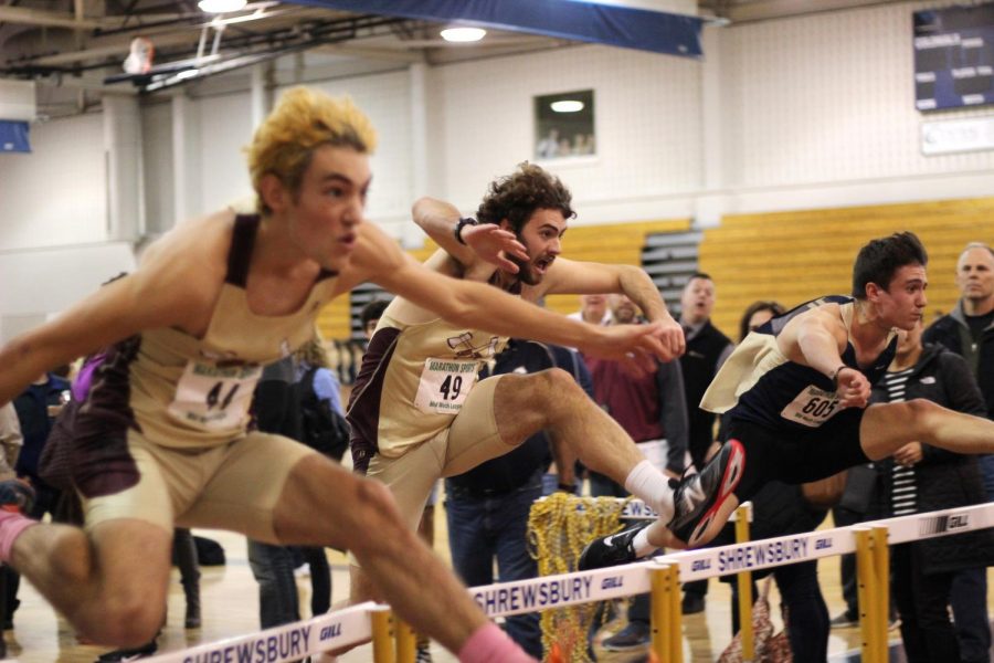 Seniors Alex Rybarczyk (left front) and Brahm VanAntwerp (right) won first and second place respectively against Shrewsbury in the 55 meter hurdle event.