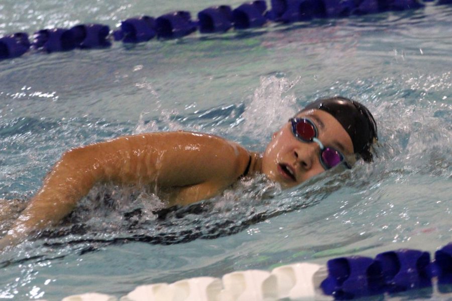 Sophomore Hikari Torikai swims freestyle on her meet on Jan. 18. 