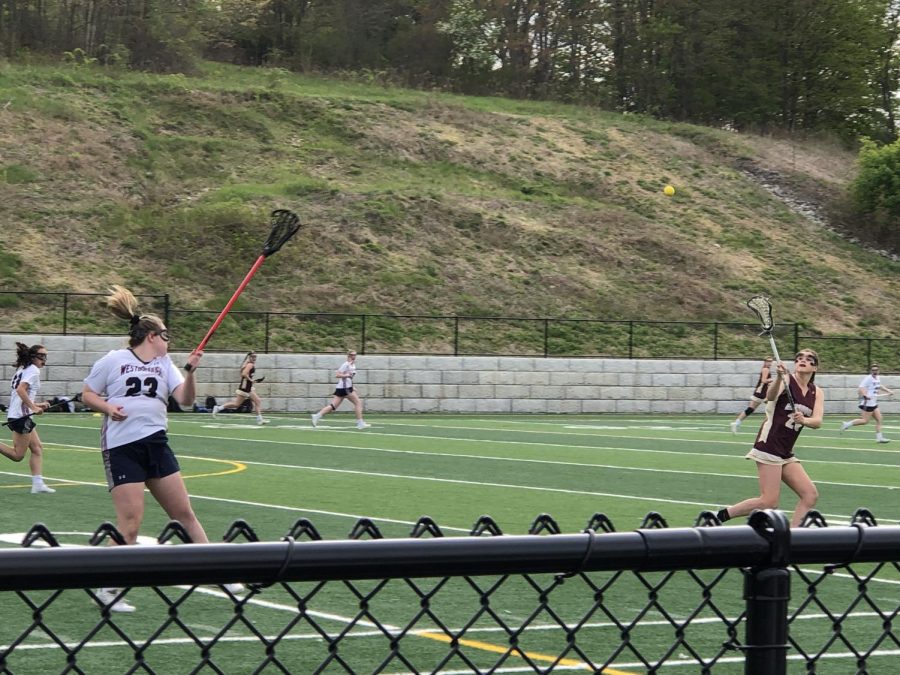 Junior Ella Kea catches the ball up field from a pass from senior Danielle Brazeau.