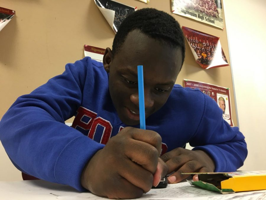 Sophomore Emmanuel Soboyejo focuses on classwork intently in English teacher John Frederick’s class.