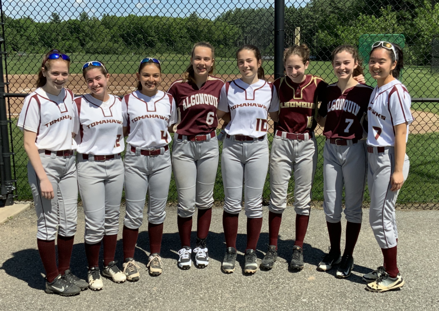 [From left to right] freshmen Charlotte Roiter, Taylor Hodge, Christina Kennedy, Meredith Sainsbury, Megan Tucker, Eve Roiter, Alison Hojlo and Angela Ke are just a few of the nine freshman that are on varsity softball.  While the team is currently going through a rough patch, they look to a bright future with the talent of their young stars.  
