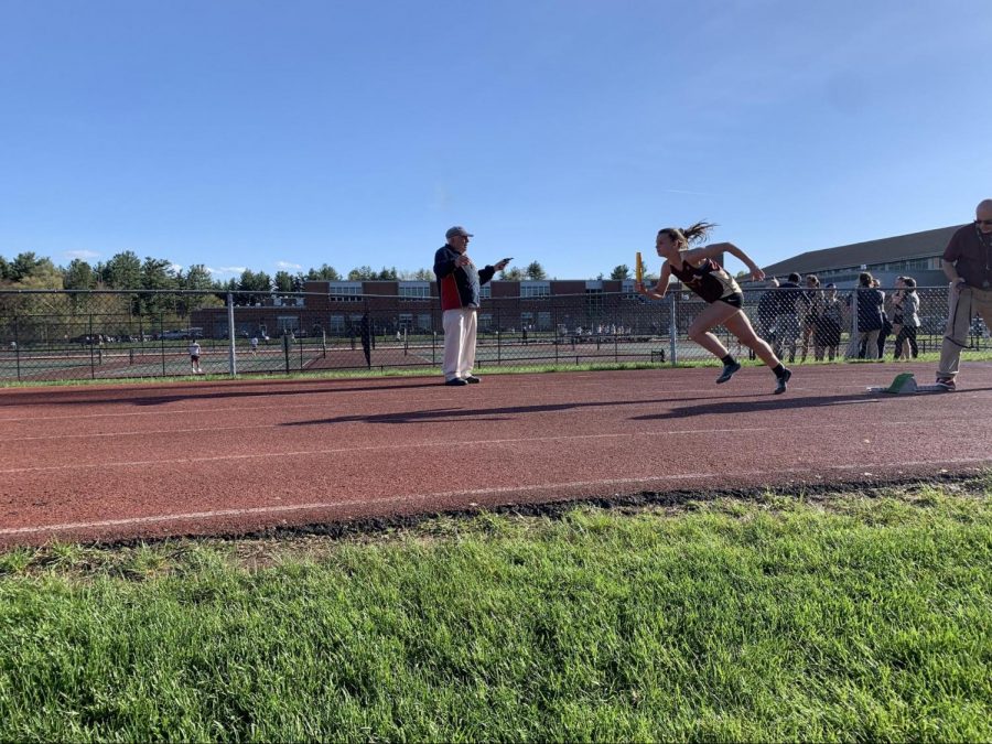 Sophomore Christina Defeudis has a strong start to the first leg of the 4 by 100 relay. 