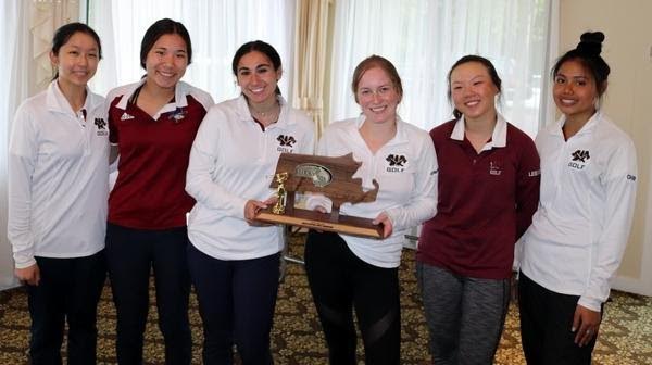 The girls golf team with their trophy from Districts.  The team won with a combined score of 382 strokes. 