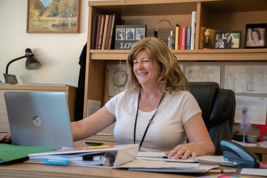 Assistant Principal Michele Tontodonato works at her computer as the school year wraps up. She will be assuming a position as Director of Finance and Operations at a different school on July 1.
