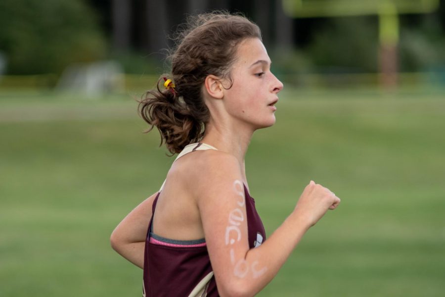 Looking ahead to finish her lap strong, senior Julia Kardos focuses on remaining towards the front of the pack. She did just that by winning the meet. The team beat Leominster 21-40.