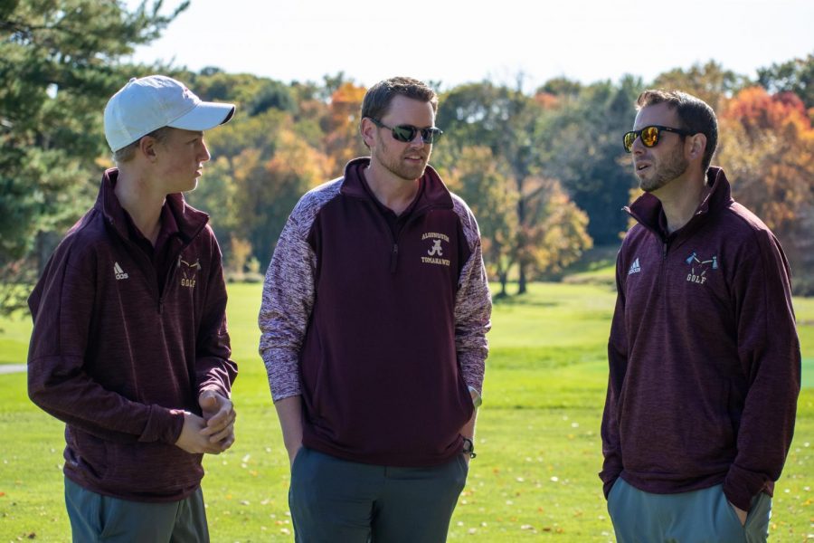 New coaches Mike Groccia (right) and Brian Calnan (middle) discuss the upcoming match against Leominster with teeam captian senior Kevin Henderson (left). 