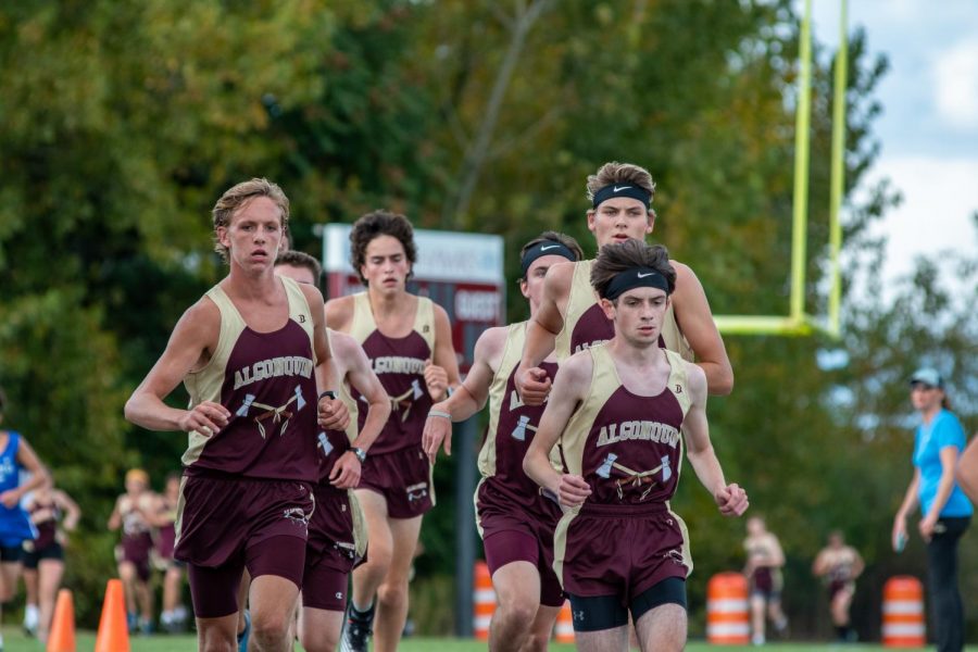 As he tries to steady his pace, senior Nick West tries to take the lead. West would eventually help Algonquin beat Leominster 15-50, as he came in first place and the team improved to 3-0 on the season.  Other top five finishers are seen behind West.