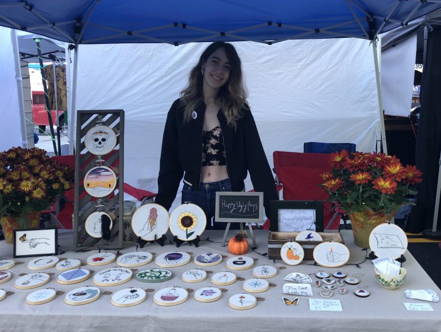 Senior Natalie MacDonald sells her crafts at stART on the Street in Worcester, Massachusetts.  She also sells online on her Etsy store Happy Ugly People.