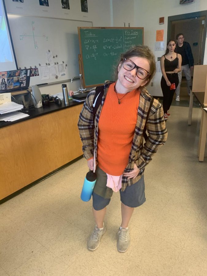 Junior Kaitlyn Desio poses in her costume before taking a physics test. My friends and I are people from a music video, Desio said. But its not very well known.