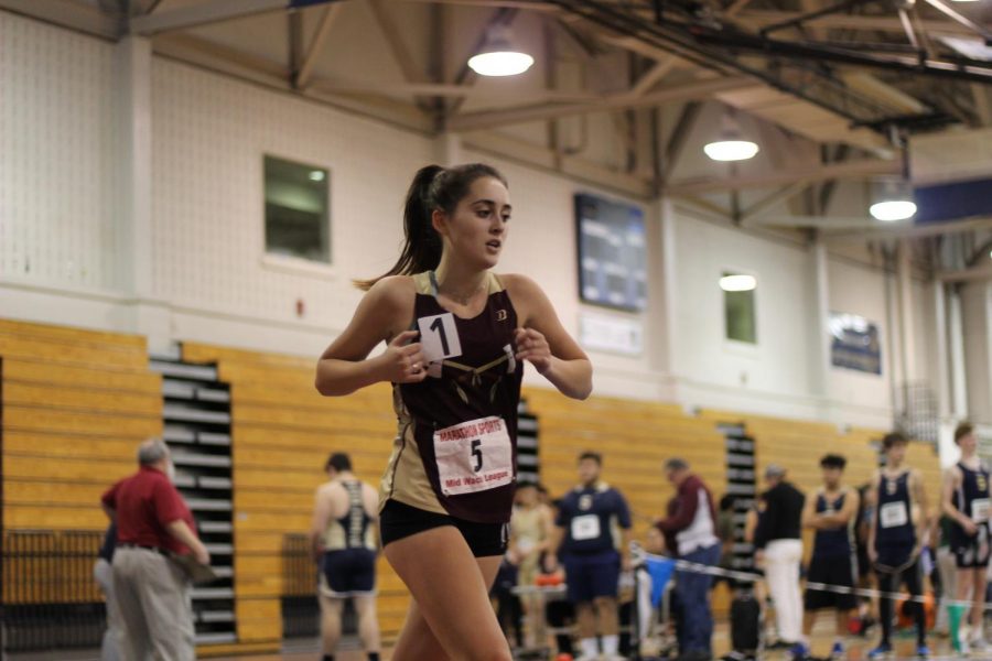 Junior Gabby Clune runs during the meet against Leominster on Dec. 12 2018.