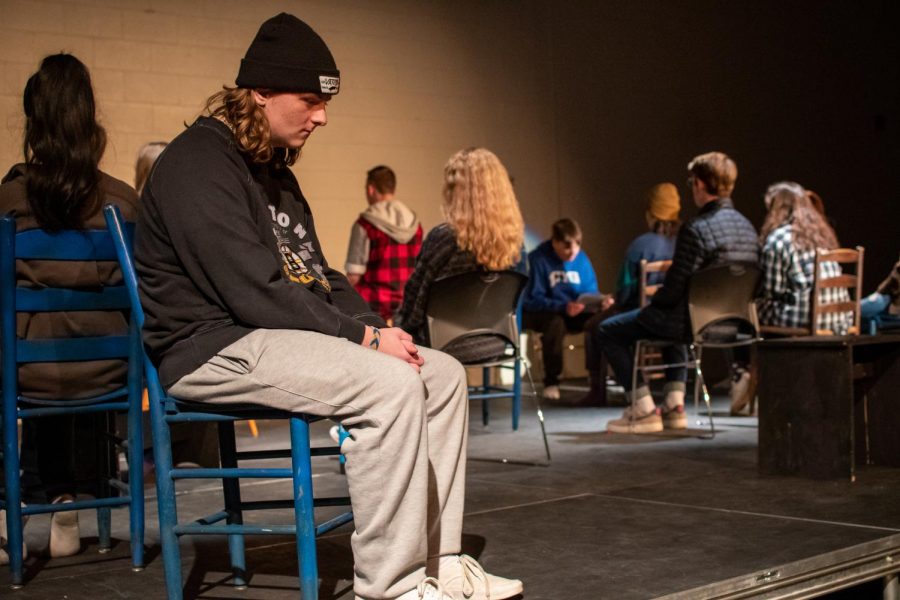 Senior Mike Cowdrey sits  in a rehearsal for The Laramie Project. 