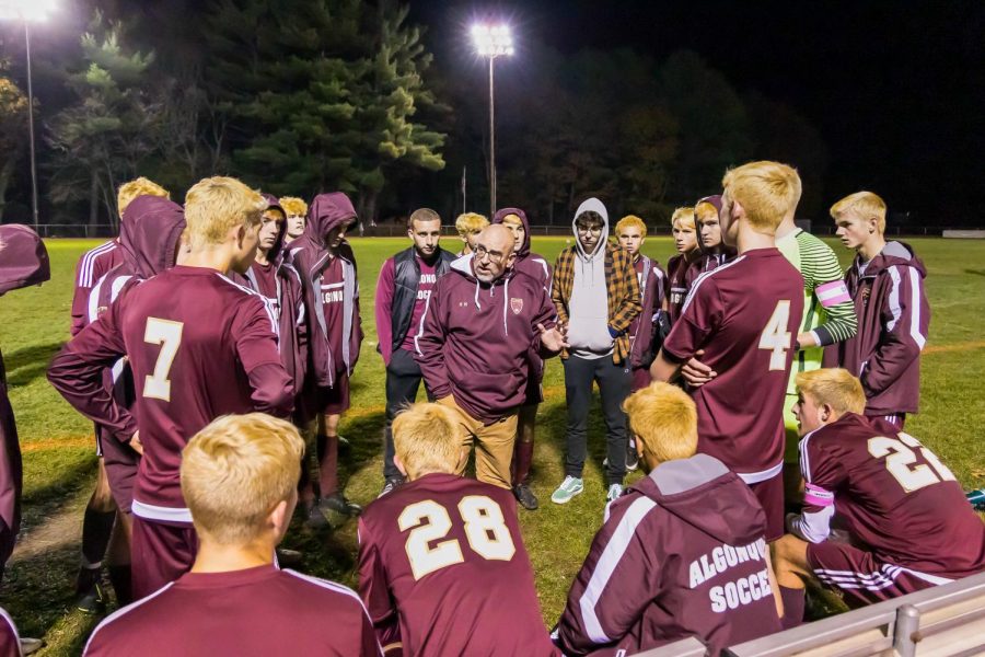 Boys soccer coach Ken Morin discusses team strategy during a break in the game on Nov. 6 vs. Westborough. Morin won 2019 coach of the year for the Midland Wachusett league.
