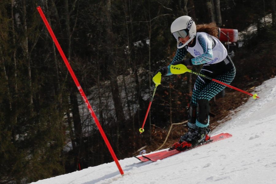 Sophomore Mina Utzschneider completes her slaomon race at the Alpine Ski State Meet on March 10, where she finished 120th after falling behind. The girls' team finished 10th in the state.