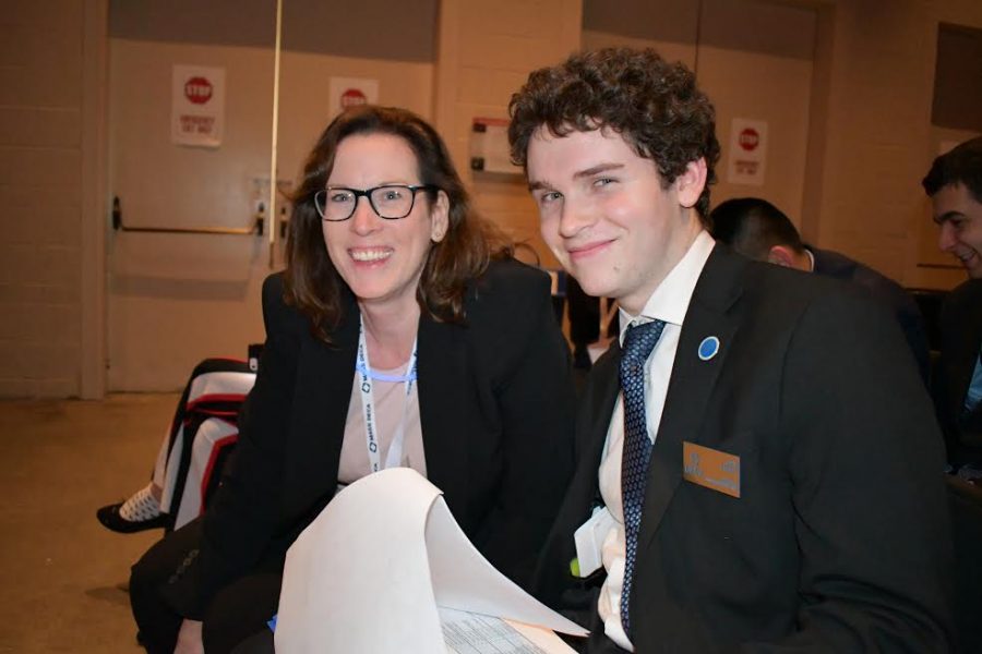 Senior Paul Probst poses with DECA adviser Patricia Riley during the 2020 DECA State Career Development Conference in Boston. As president of the club, Probst is responsible for the chapter's logistics for this conference.