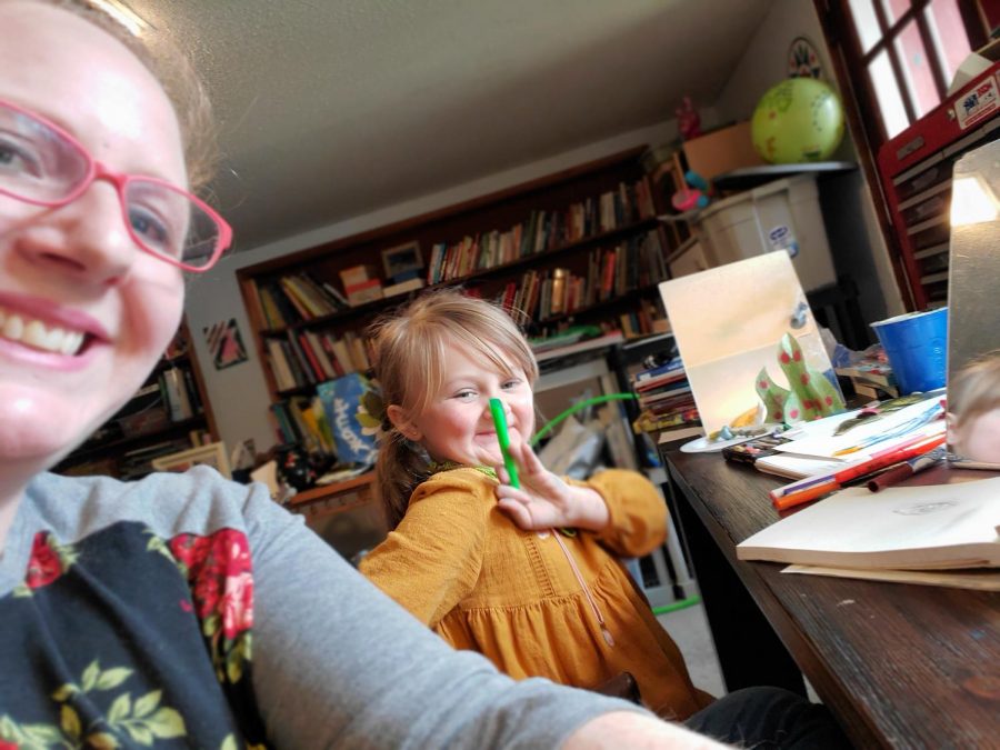 Art teacher Rebecca Duffy and her child while remote learning from home.