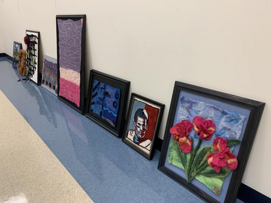 Cindy Kennelly dropped off a lot of her artwork to be shared at the show. Some were framed landscapes and portraits (featured) and others were felted objects (not pictured. We laid the works on the floor, as we waited for artists to come pick up their art from the previous gallery.
