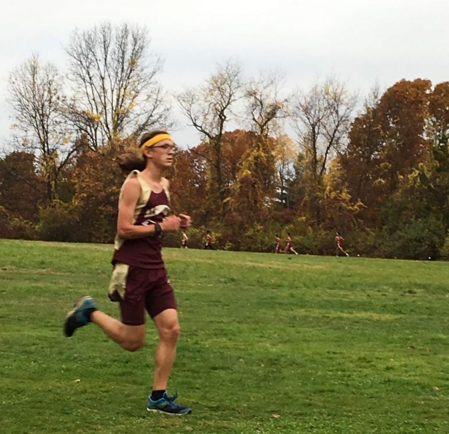After settling into his race, senior Zane Walter looks to pass a pack ahead of him in a cross country meet.