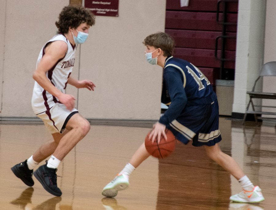 Freshman Brennan Rice guards a player during the JV2 basketball game against Shrewsbury on January 22.