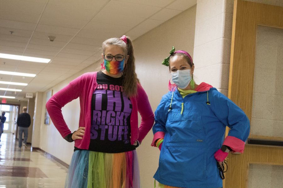 Along with the rest of the social studies department, social studies teachers Kristen Turner and Renee Moulton dress in head to toe neon for their 80s theme Halloween costume. 