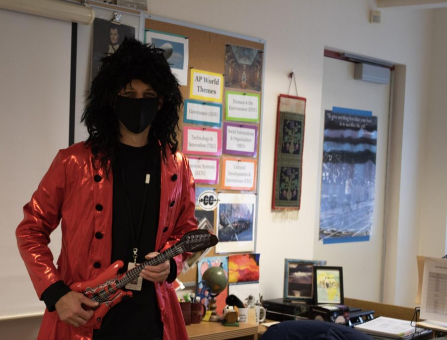 Social studies teacher Nathaniel Uttaro participates in this years Halloween festivities with his rock star costume. 