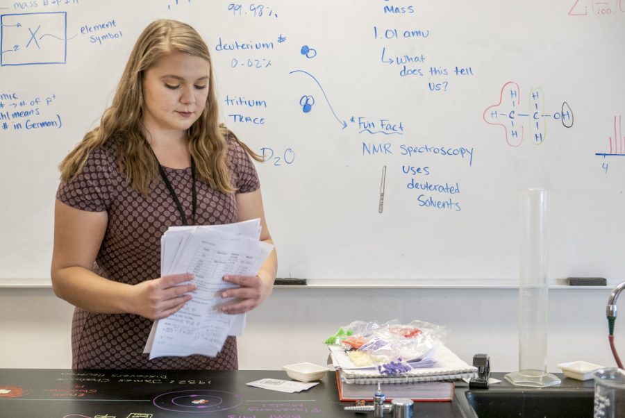 New science teacher Emma Travassos sorts through tests after a long day of school. Travassos hopes to share her passion for chemistry with students but learn about their daily lives as well.