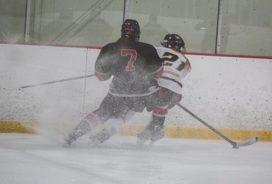 Senior captain Kerryn OConnell tries to keep the puck away from an opponent at the January 9 game.