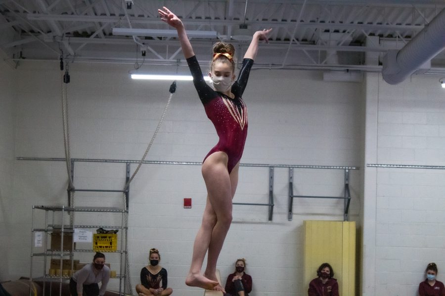 Freshman Olivia LaBelle performs her beam routine at the January 16 meet against Groton-Dunstable. 