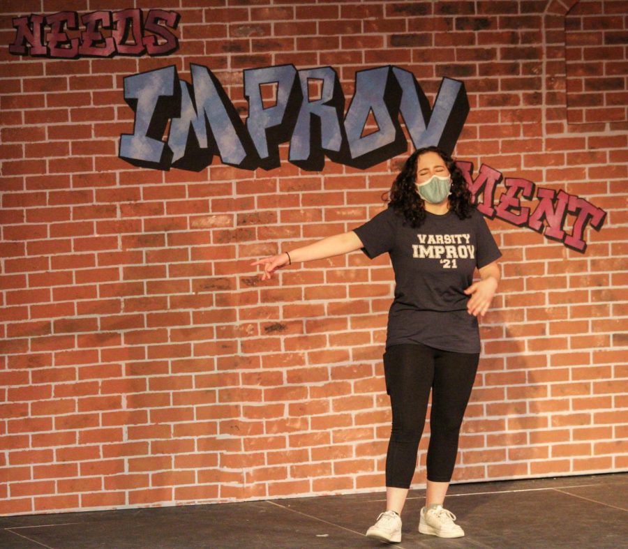 Students also had the chance to show off some amazing vocal skills. Junior Mari Fellenbaum does some singing during the musical improv portion of the show.