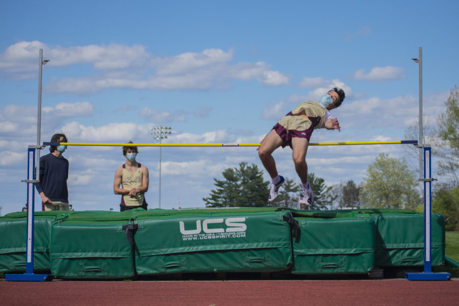 Sophomore Matt Pianka clears the high jump bar. The boys fell short of the win against the Mountaineers. 