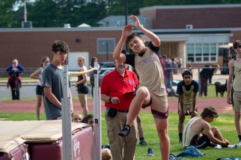 Sophomore Trevor Kerxhalli clears the high jump at the meet against Advanced Math & Science Academy Charter on June 1st. This is one of their first meets without the requirement to wear masks.