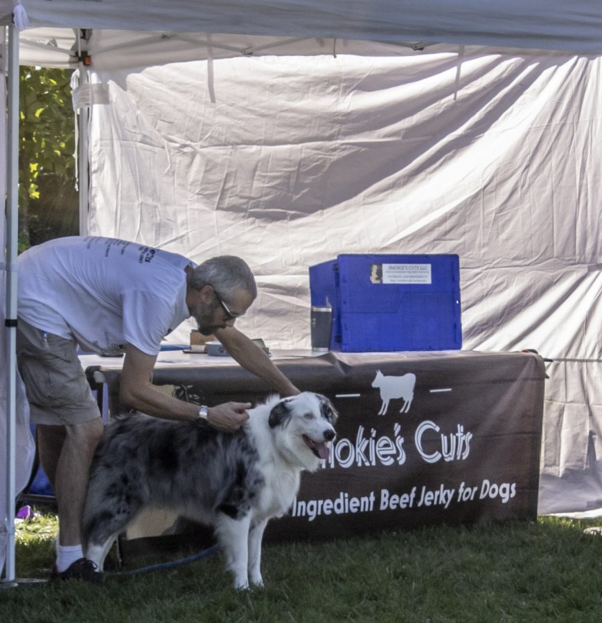Smokies Cuts had a dog at their tent to help sell their dog treats. 