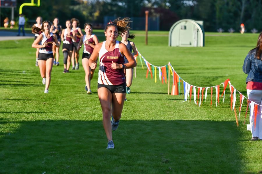Trying to stay ahead of the pack, senior Joli Dantz keeps her pace. Algonquin won the meet against Shrewsbury 25-32.