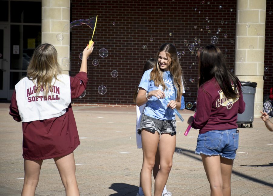 Sophomore Ava Priest and other ARHS students use bubbles during Funky Friday on Oct. 15, hosted by the Take Action club.
