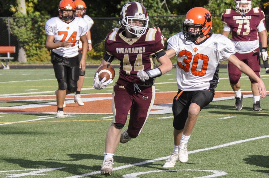 Owen Ellsworth tries to gain the outside edge in Algonquins 24-8 blowout of Marlborough on Saturday, October 23, 2021.