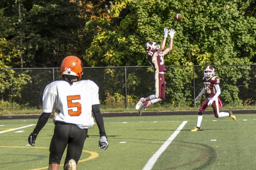 Freshman safety Nicholas Klein makes a leaping catch to intercept Marlboroughs pass in Algonquins JV 24-8 victory on Saturday, October 23, 2021.