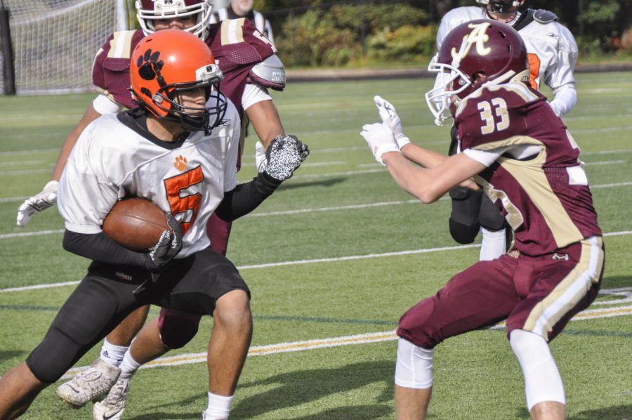 Freshman Nicholas Klein attempts a tackle Marlboroughs running back during the JV football teams commanding victory on Saturday, Oct. 23.