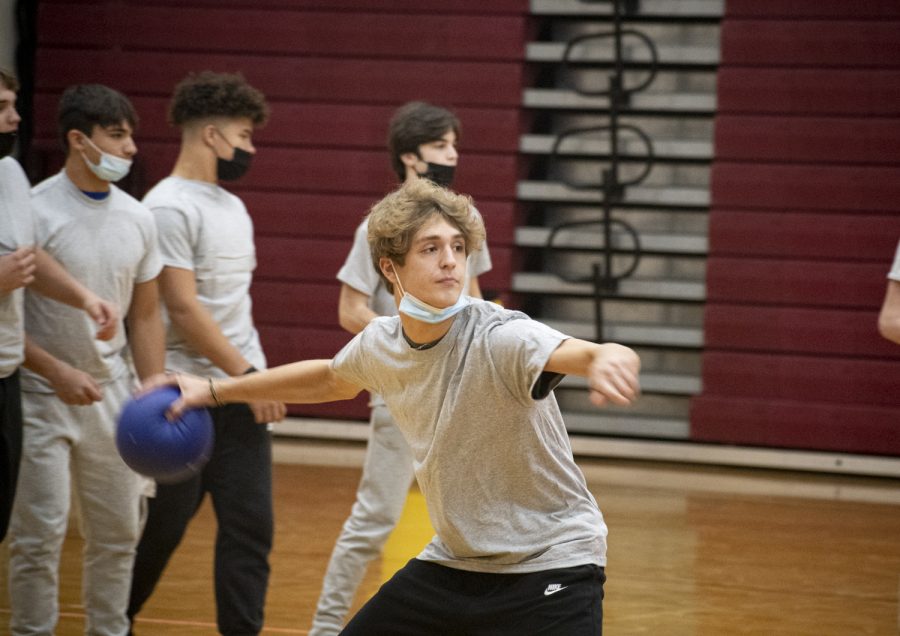 In the dodgeball tournament on Monday, Nov. 22, sophomore Andrew Eiben winds up to throw a ball at a player on the other team.