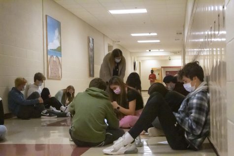 Students wear their masks while working in the hall on Friday, Nov. 12.